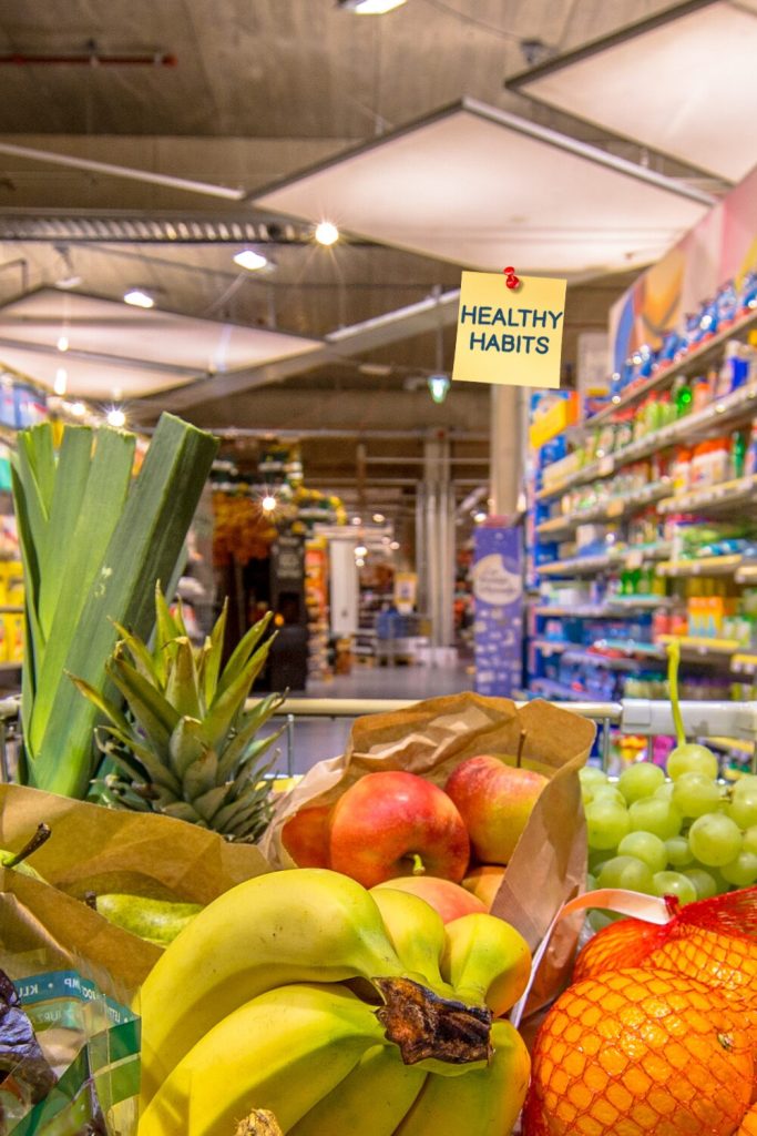Grocery basket filled with colourful fruits and vegetables